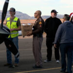 Volunteers getting the presents out of the planes. (KSL TV)