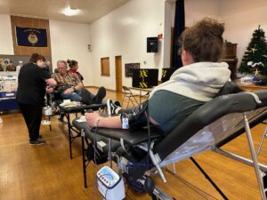 Two blood donors at the 'Battle of the Badges' event. 