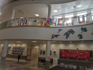 A banner saying "Love is powerful", being displayed in the school's hallway. 