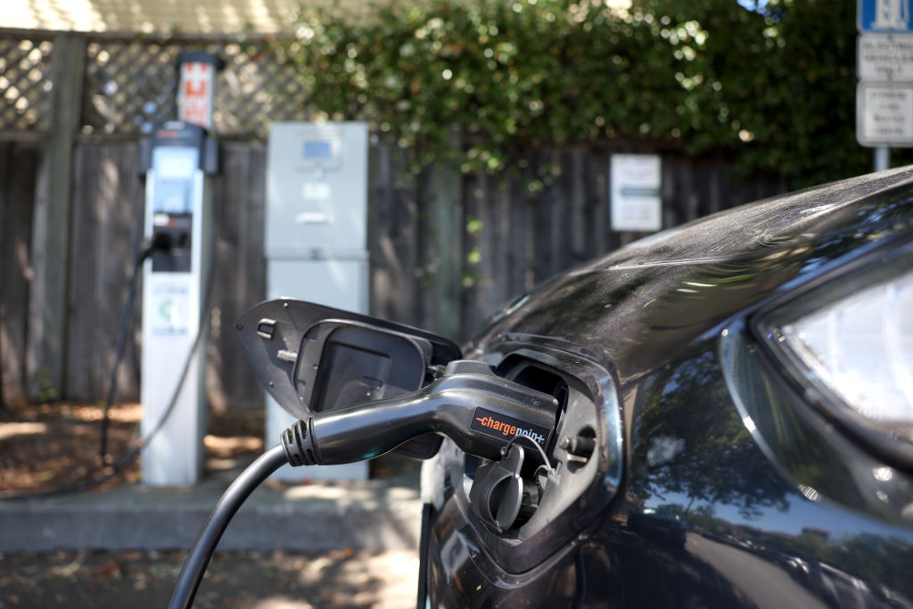 FILE: A Nissan electric car sits parked at a Charge Point EV charging station on July 28, 2023 in S...