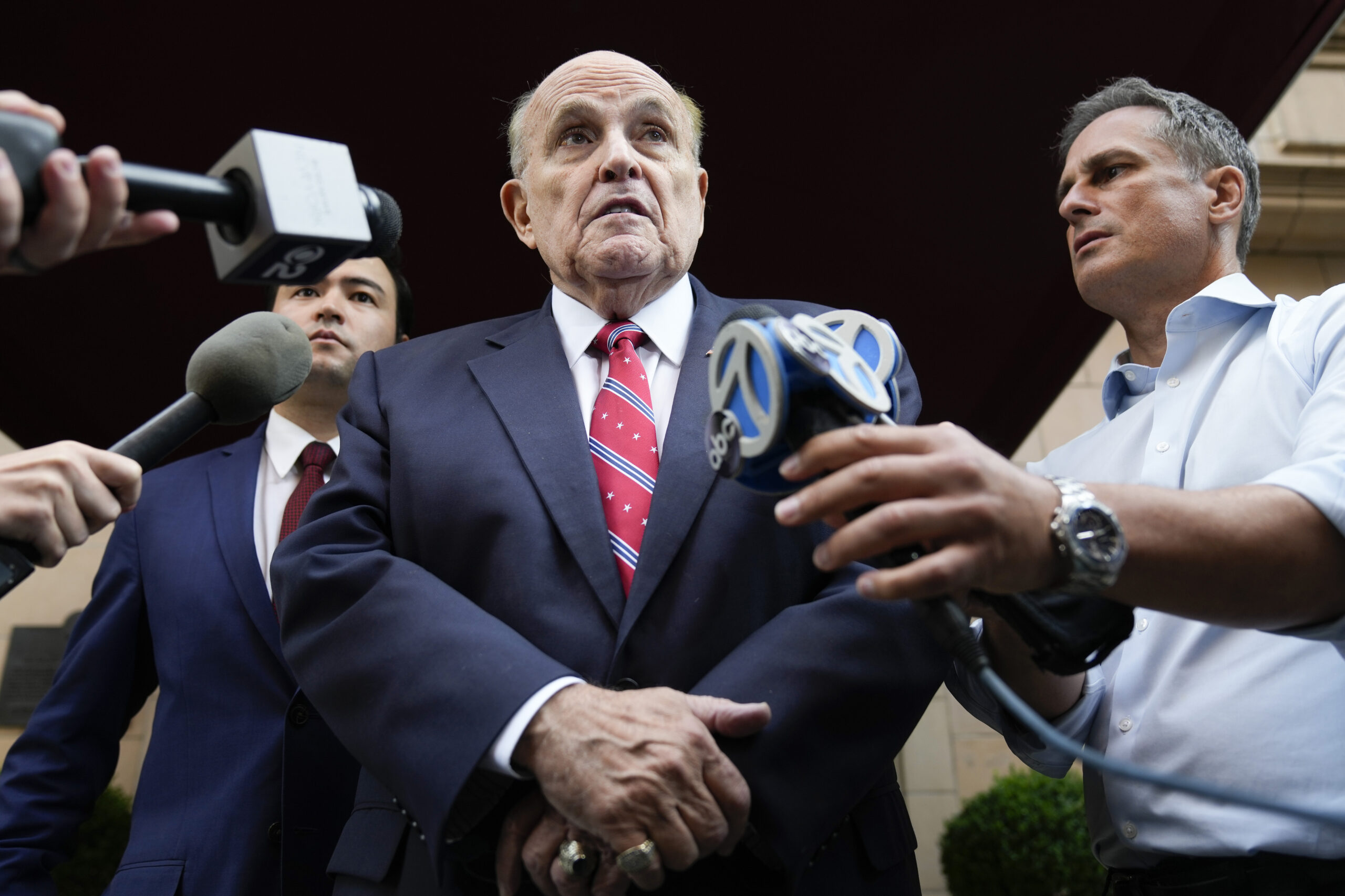 FILE - Former Mayor of New York Rudy Giuliani speaks to reporters as he leaves his apartment buildi...
