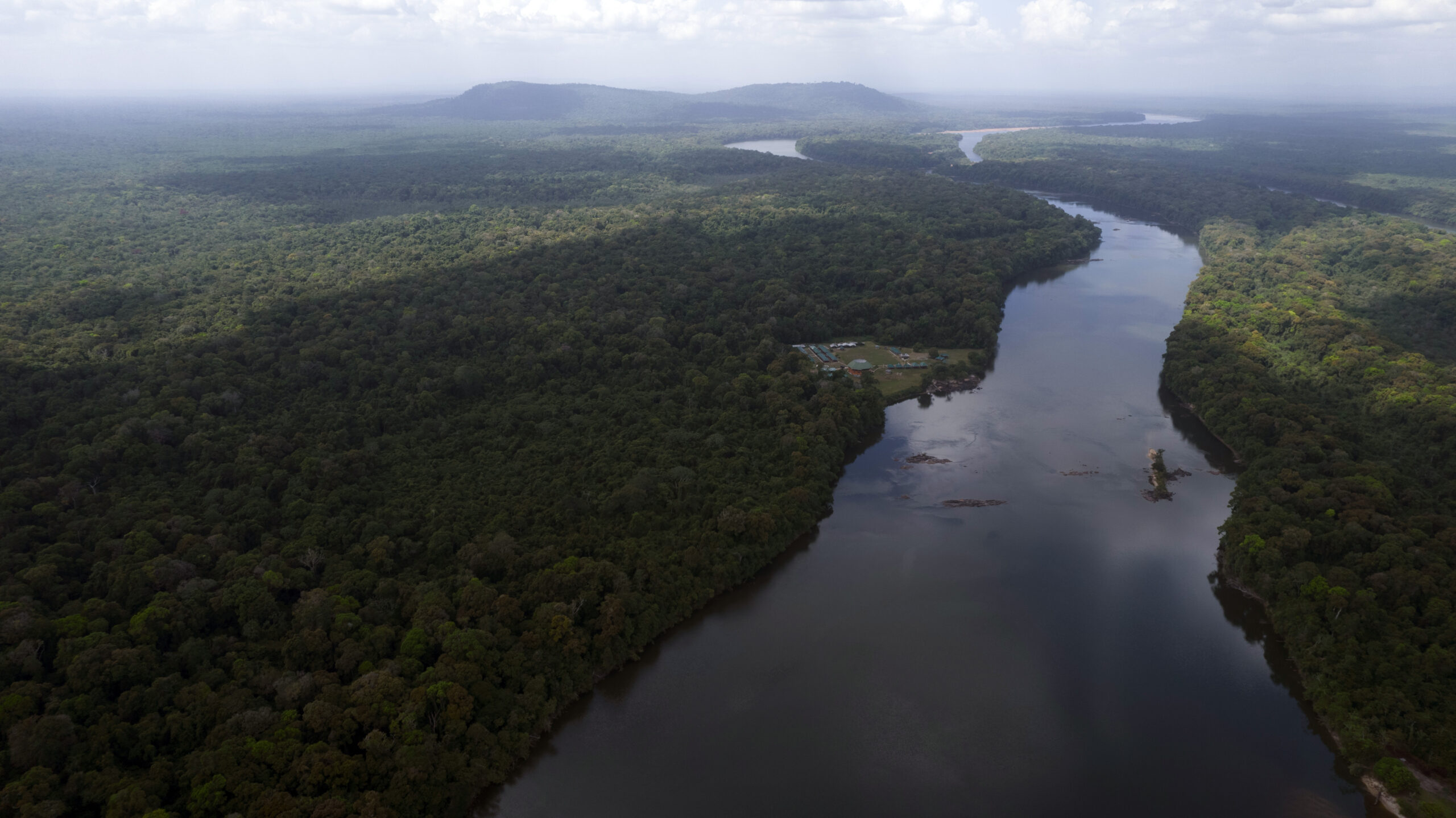 The Essequibo River flows through Kurupukari crossing in Guyana, Saturday, Nov. 19, 2023. Venezuela...