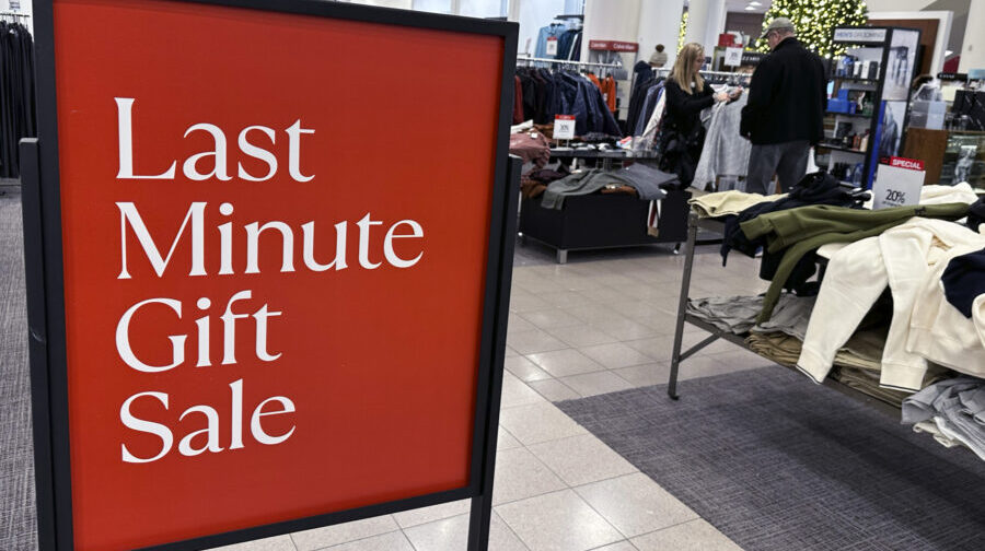 A sign aimed at last minute holiday shoppers is displayed at a retail store in Schaumburg, Ill., Mo...