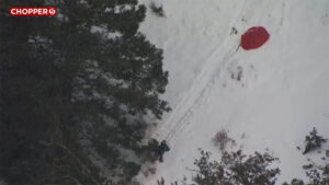 Paraglider crash on a snowy mountain