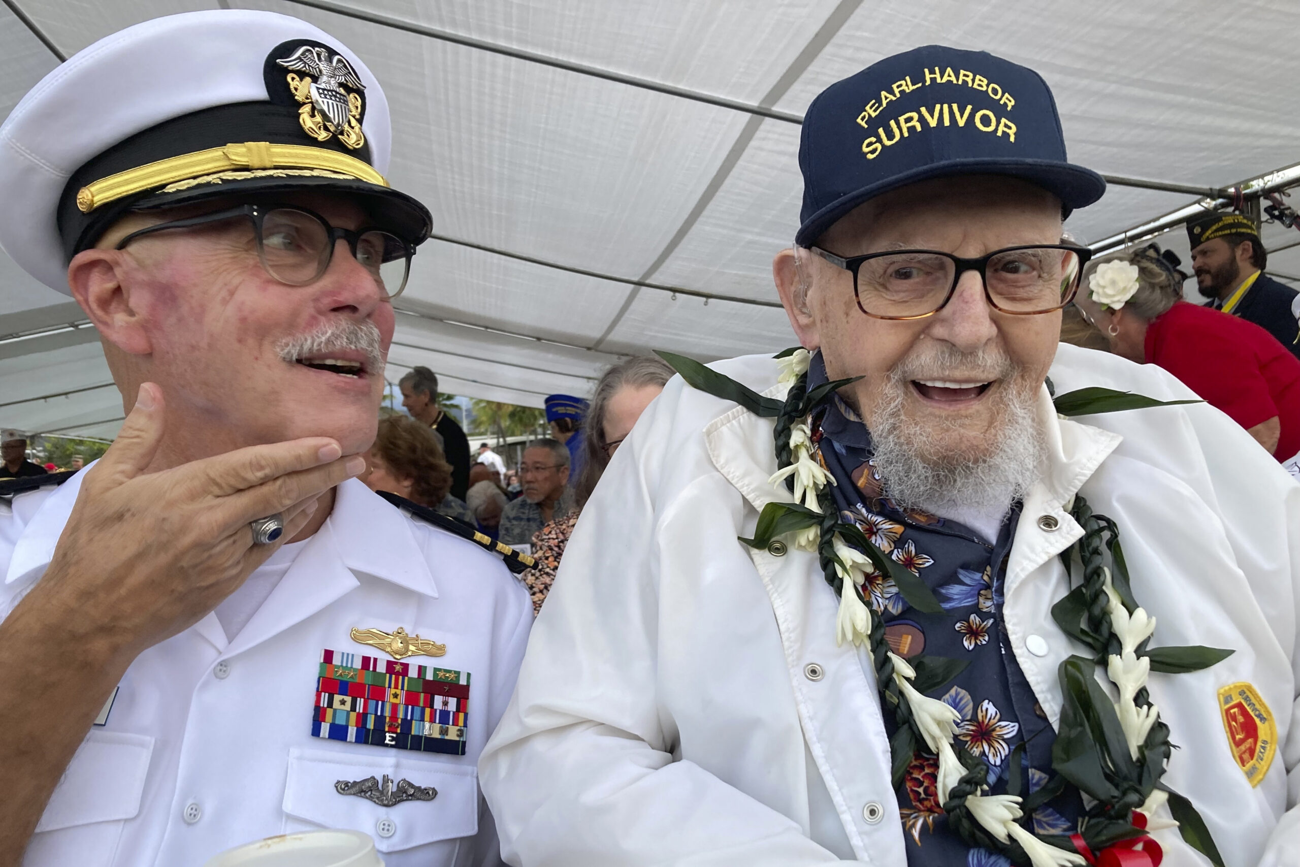 FILE - Ira Schab, right, who survived the attack on Pearl Harbor as a sailor on the USS Dobbin, tal...