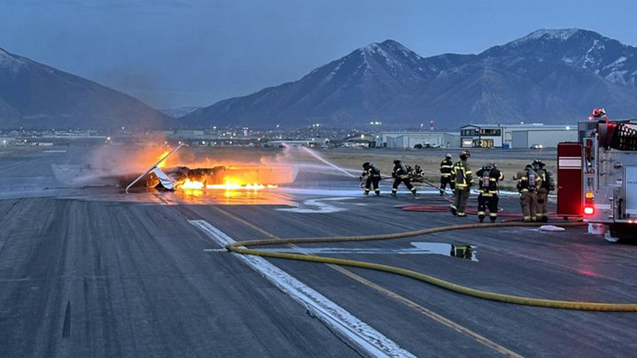 A plane burns on the runway after it caught fire at approximately 10,000 feet on Thursday, Dec. 21,...