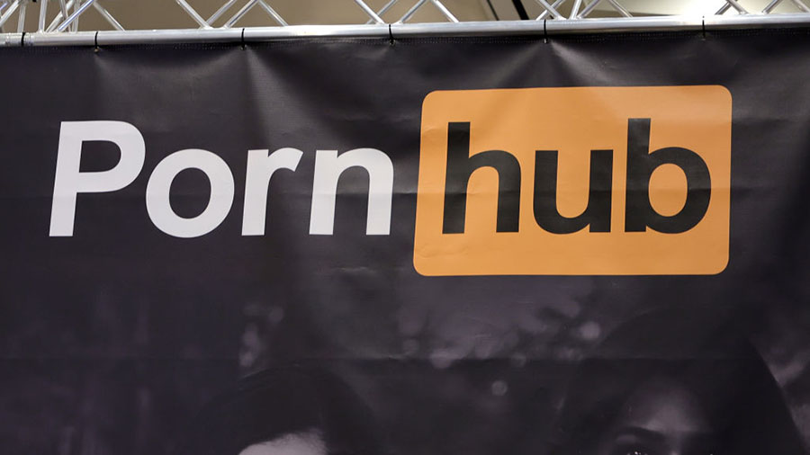 A sign hangs at the Pornhub booth at the 2023 AVN Adult Entertainment Expo at Resorts World Las Veg...
