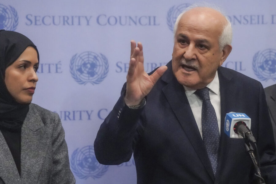 Palestinian United Nations Ambassador Riyad Mansour, right, speaks during a press conference ahead ...