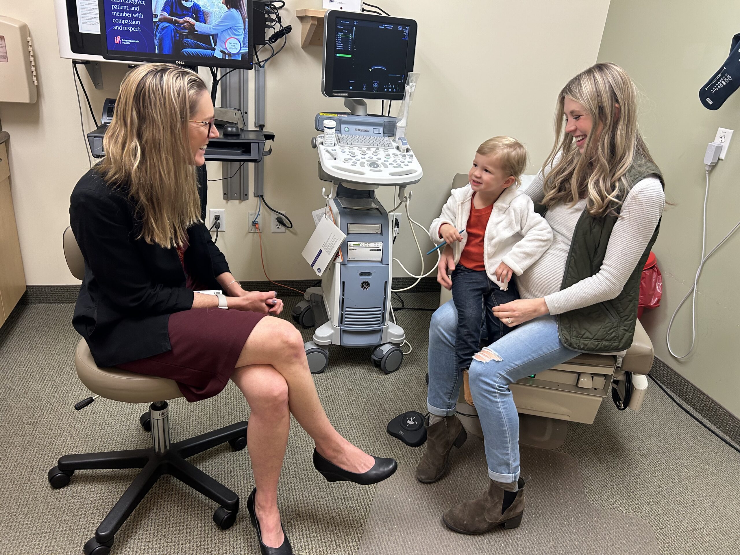 Davis (right) with her child visiting her doctor. (KSL TV's Emma Benson)...