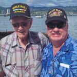 Carroll (left) next to a Gulf War veteran. (Courtesy: Ed Carroll) 