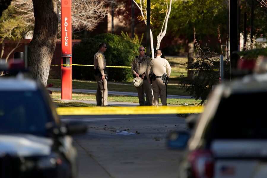 Las Vegas police stand near the scene of a shooting at the University of Nevada, Las Vegas, Thursda...