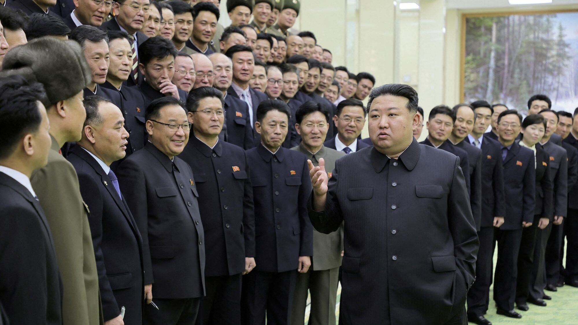 North Korea's leader Kim Jong-un meets with members of the Non-Standing Satellite Launch Preparatio...