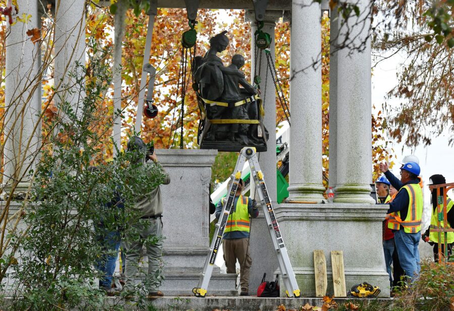 Crews begin the process of removing Confederate statues from a monument in Jacksonville's Springfie...