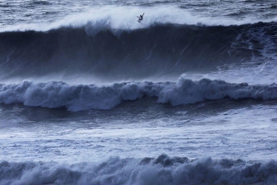 A surfer catches some air off a wave at Mavericks Beach near Half Moon Bay, California, on Dec. 28....
