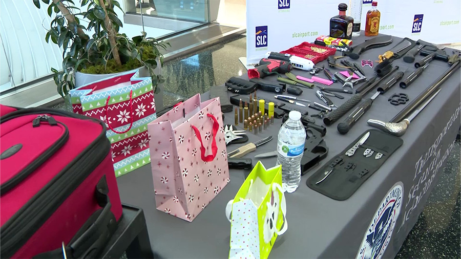 A table displaying confiscated items by TSA at Salt Lake City International Airport on Dec. 18, 2023. (KSL TV) 