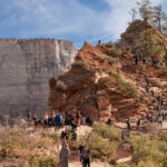Hikers waiting to climb, climbing, or descending the trail to Angels Landing near Scout Lookout in Zion National Park. (Lizz Eberhardt, NPS)