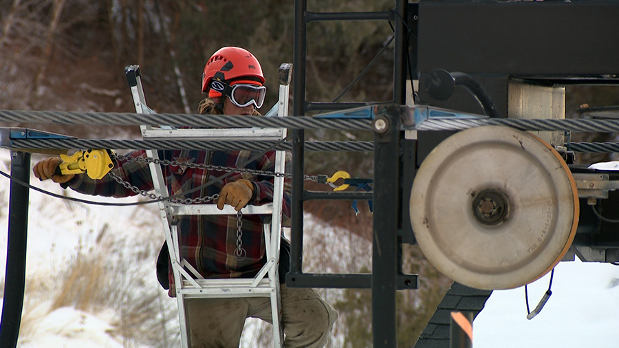 Utah ski resorts need snow or cold temperatures to make snow. Here a worker checks a lift at Cherry...