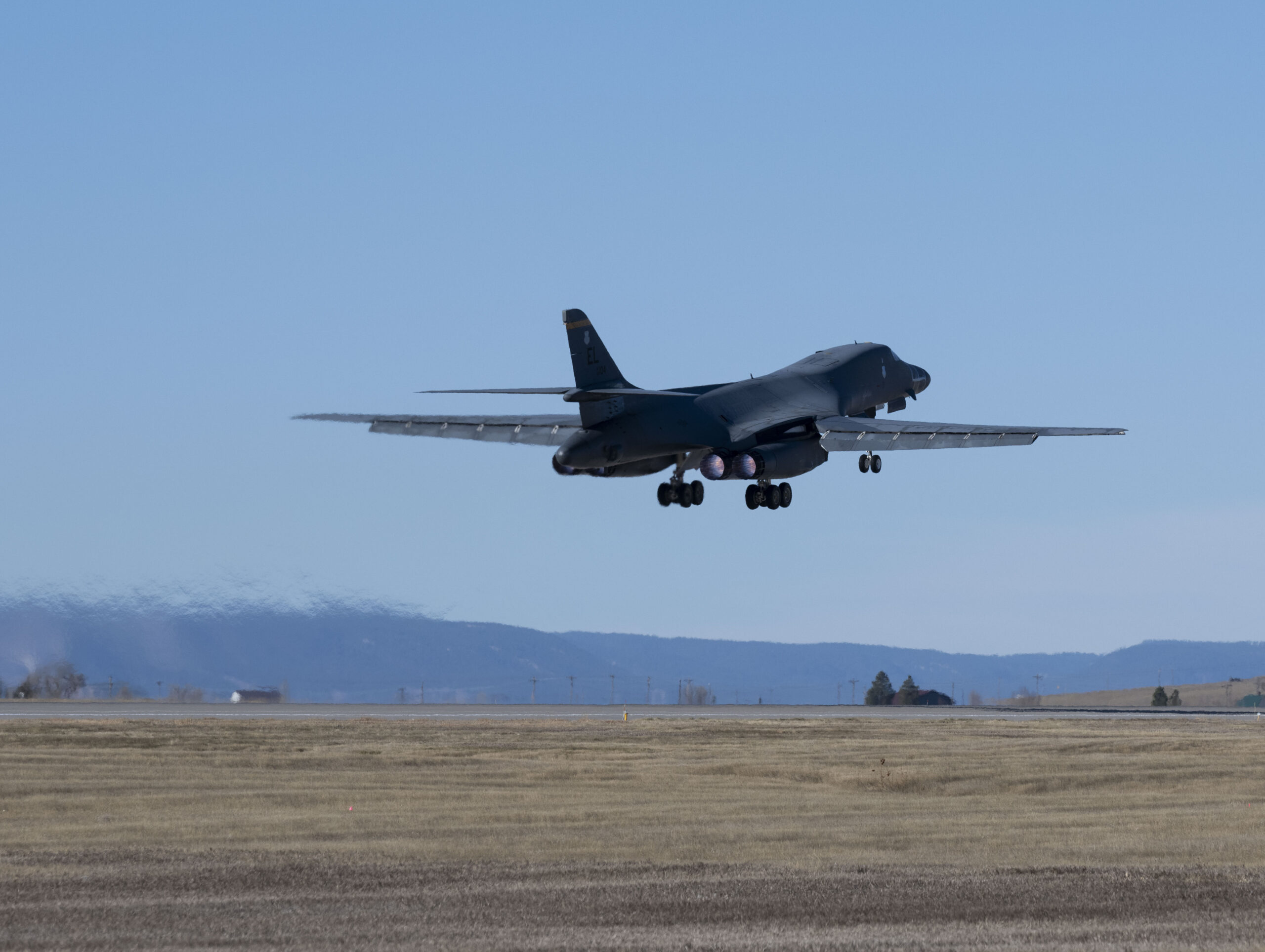 A B-1B Lancer attached to the 37th Bomb Squadron at Ellsworth Air Force Base, South Dakota, departs...
