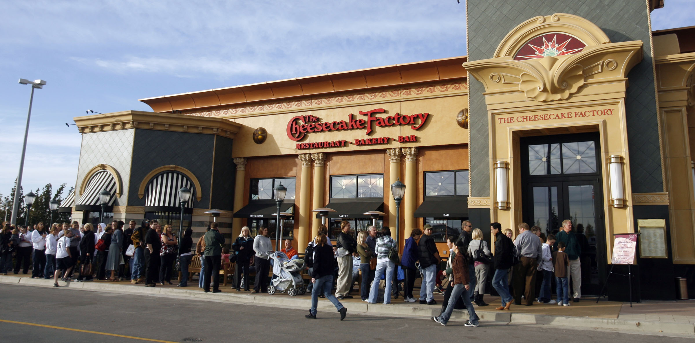 FILE: Patrons line up outside the Cheesecake Factory in Murray as the restaurant opens its doors fo...