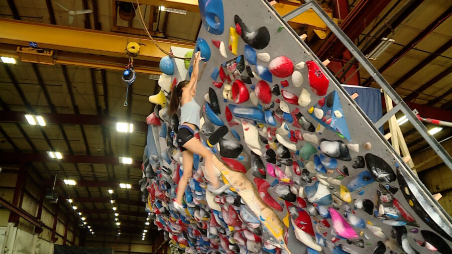 A climber works out in a gym....