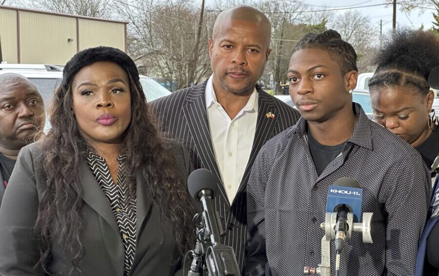 Darryl George, an 18-year-old junior, along with his lawyer, Allie Booker, left, and Texas state Re...