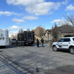 Police in front of the home where the fatal shooting happened. (KSL TV)