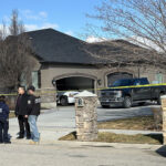 Police in front of the home where the fatal shooting happened. (KSL TV)