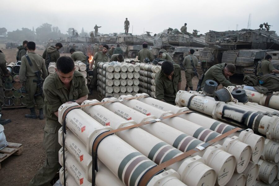 Israeli soldiers organize tank shells after returning from the Gaza Strip on January 1, at Israel's...