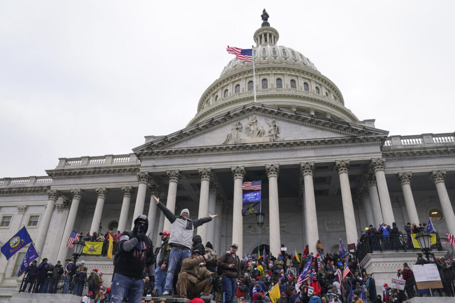 Rioters at the U.S. Capitol on Jan. 6, 2021, in Washington. Hundreds of people charged with stormin...