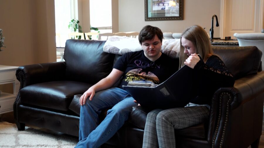 Shaynie and Trey Hunter look at a photo album at their home in Elk Ridge. (Josh Szymanik,, KSL TV)...
