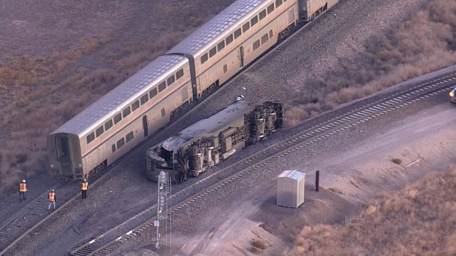 Three people were injured when an Amtrak train hit a semi hauling milk and derails in Northern Colo...