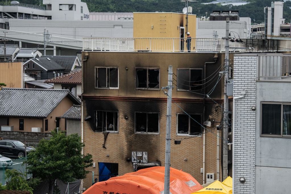 FILE: Emergency services personnel work at the Kyoto Animation Co studio building after an arson at...