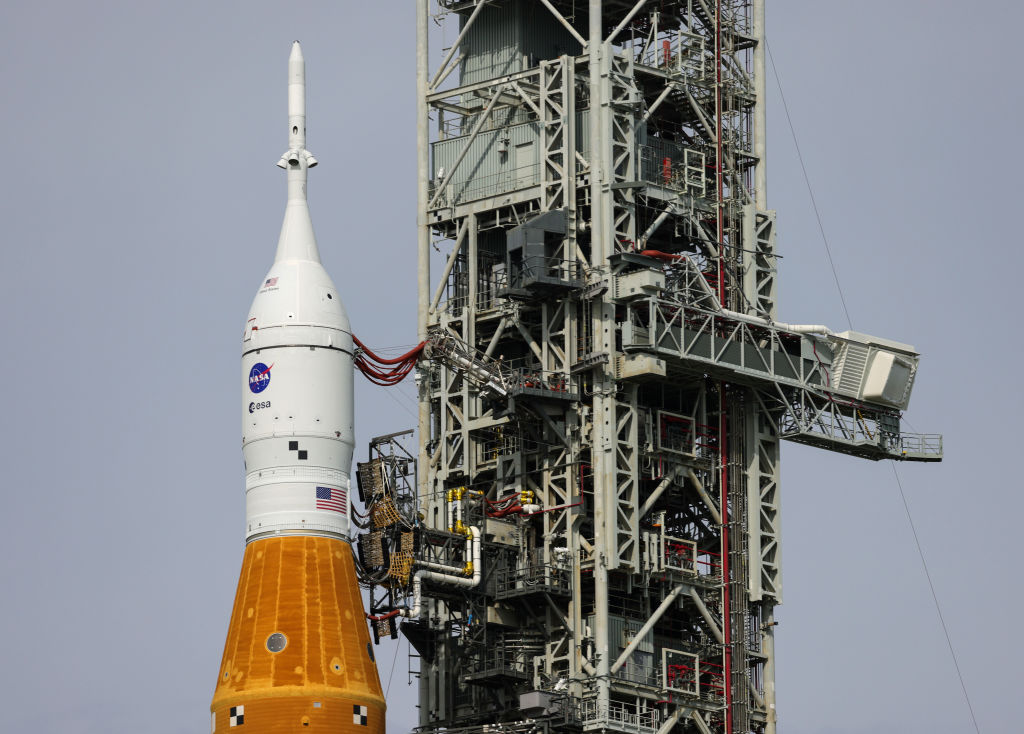 FILE: NASA's Space Launch System (SLS) rocket with the Orion spacecraft attached rests on launch pa...