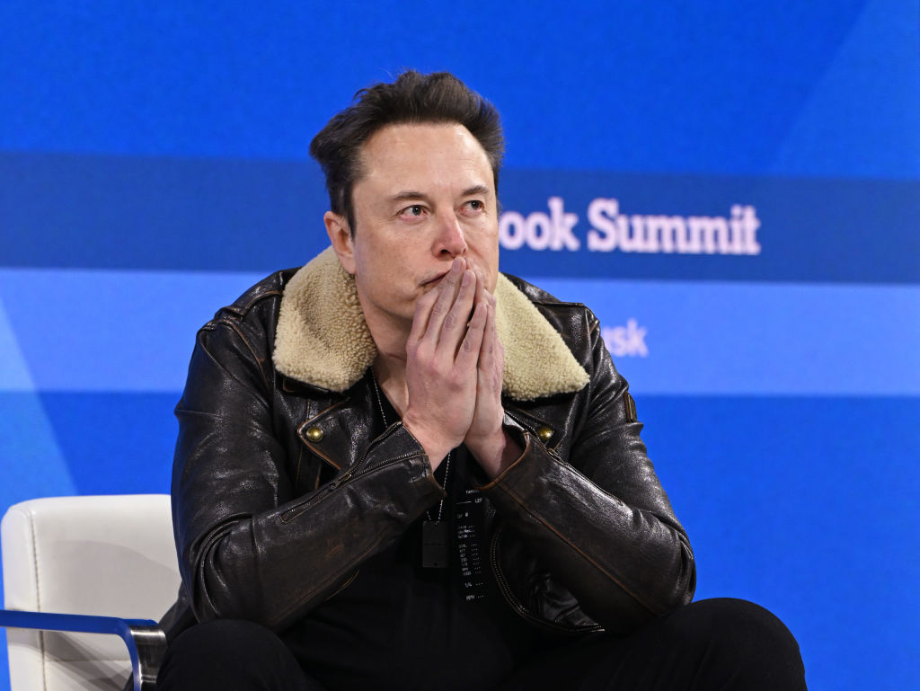 NEW YORK, NEW YORK - NOVEMBER 29: Elon Musk speaks onstage during The New York Times Dealbook Summi...