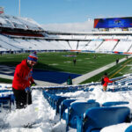 ORCHARD PARK, NEW YORK - JANUARY 15: Rob Limoncelli shovels snow before the AFC Wild Card playoff game between the Buffalo Bills and Pittsburgh Steelers at Highmark Stadium on January 15, 2024 in Buffalo, New York. The Bills hired local residents to help clear snow from the stadium before today's game. A blizzard caused the game to be postponed from Sunday. (Photo by Sarah Stier/Getty Images)