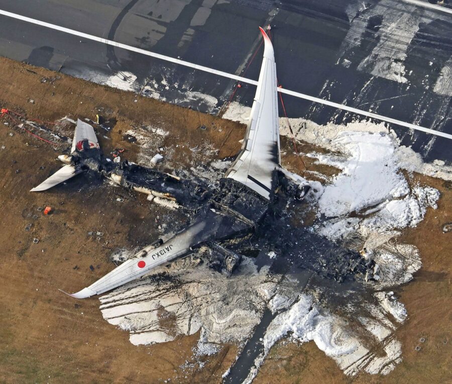 The burnt-out Japan Airlines plane is pictured at Haneda airport on Wednesday. (Kyodo News, AP)...