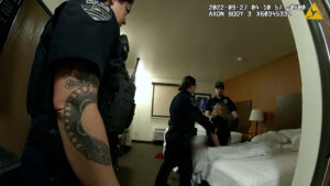 Officers inside of Meyer's room while she was in handcuffed on a bed.
