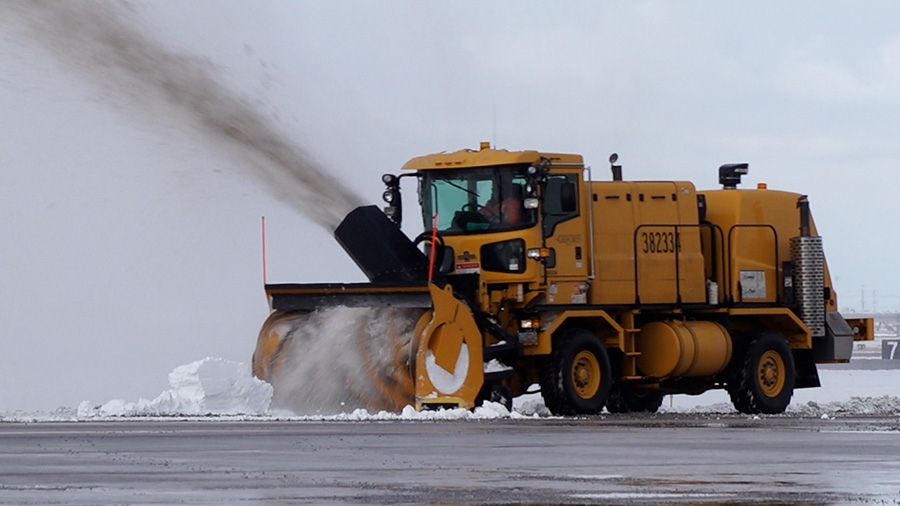 A blower shoots snow off of a runway at Salt Lake International. (KSL TV)...