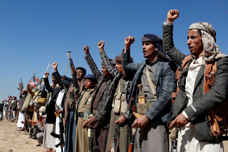 Houthi fighters and tribesmen stage a rally against the US and the UK strikes on Houthi-run militar...