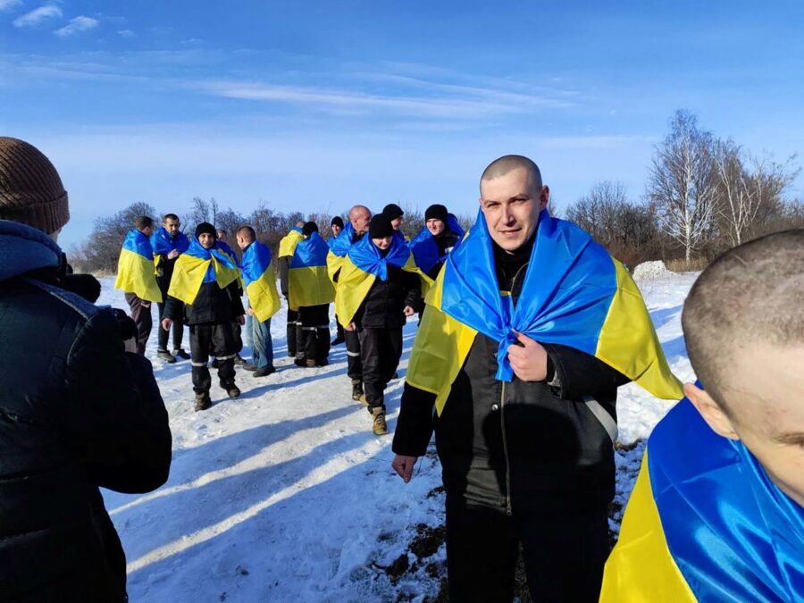 Ukrainian prisoners of war returning home after a swap at an unknown location in Ukraine, January 3...
