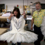 Ballet West costumes that were used in a Taylor Swift video will be back on the stage next month in the production of Swan Lake, held up here by Cindy Farrimond and Jason Hadley on Jan. 2, 2024. (Mike Anderson, KSL TV)