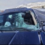A slab of ice from the top of a vehicle was launched into oncoming traffic and another driver's windshield on Monday. This happened as a trailer traveled on state Route 32 in Summit County.  (UHP)