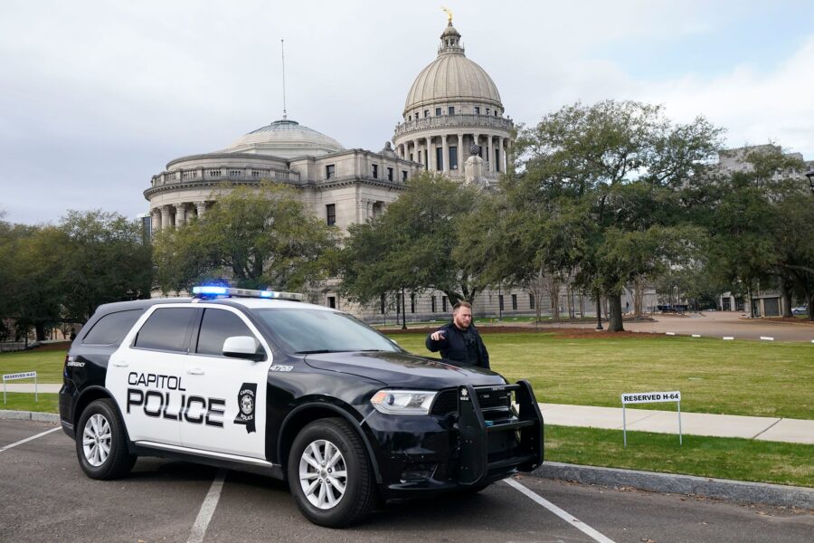 A Capitol Police officer warns off passersby as they respond to a bomb threat at the Mississippi St...