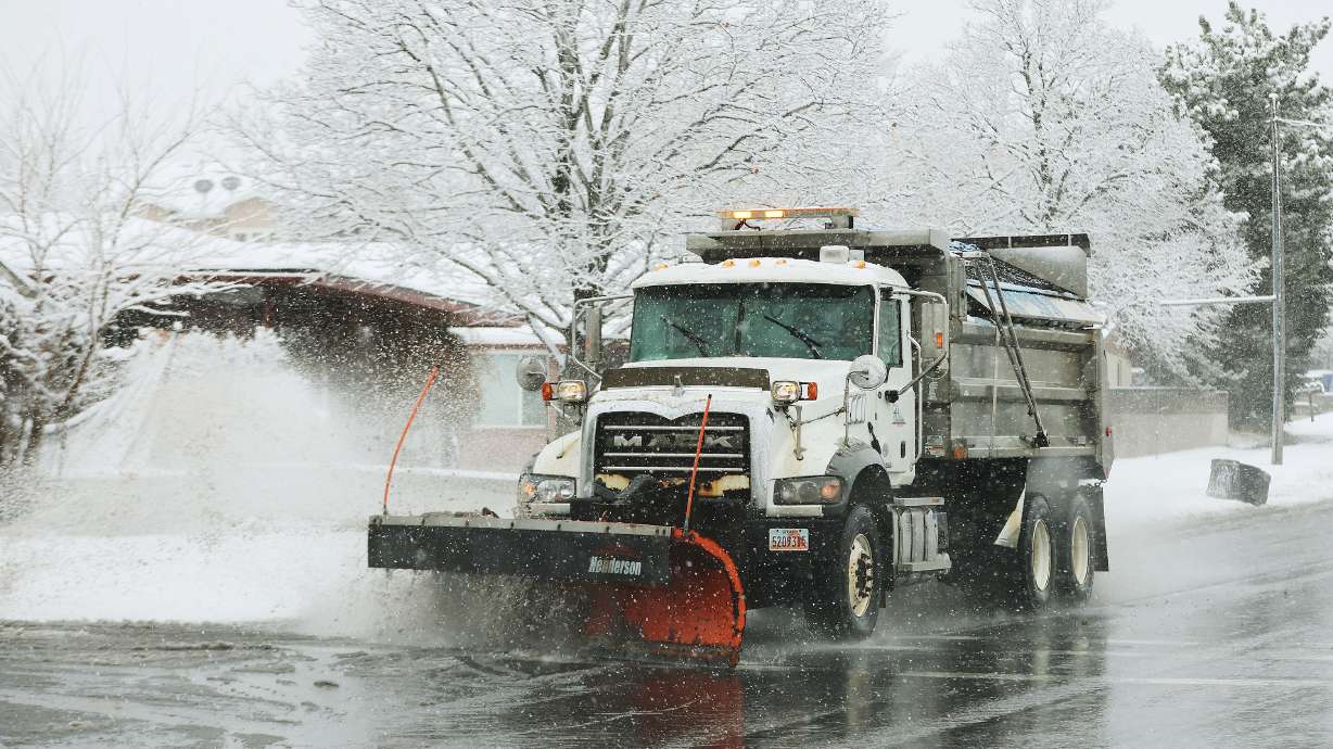 A snowplow clears the road in Cottonwood Heights on Feb. 9. An incoming storm is expected to provid...