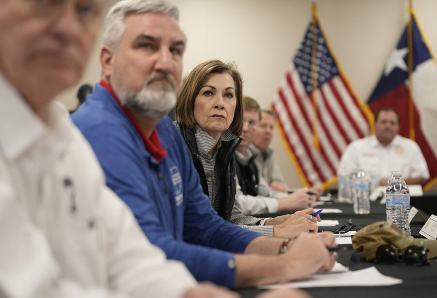 Iowa Gov. Kim Reynolds listens at a press conference about border policies in Eagle Pass, Texas on ...