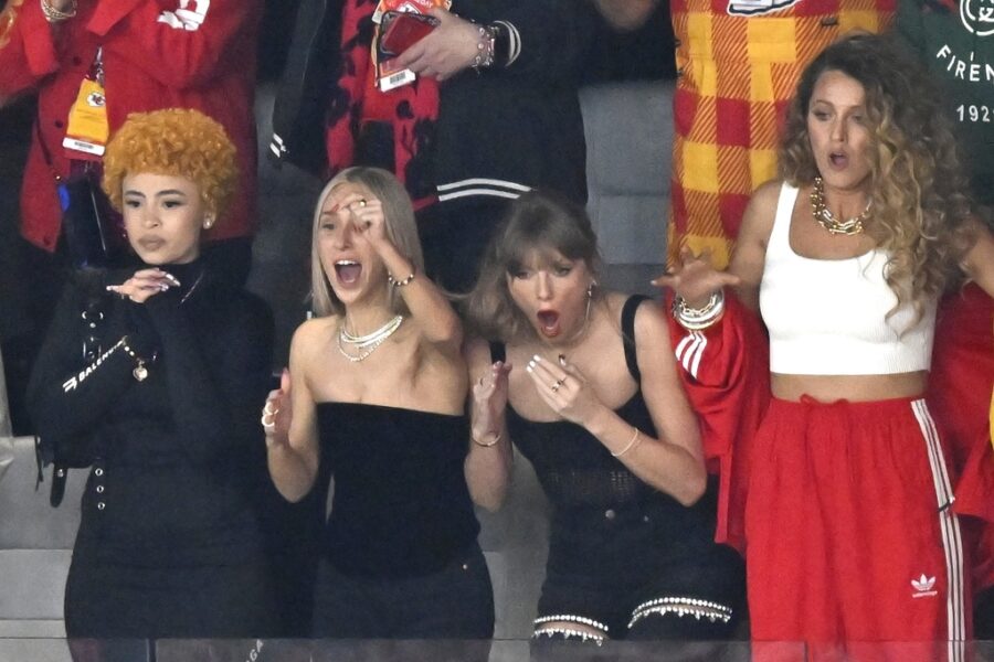 Ice Spice, from left, Ashley Avignone Taylor Swift and Blake Lively react during the first half of ...