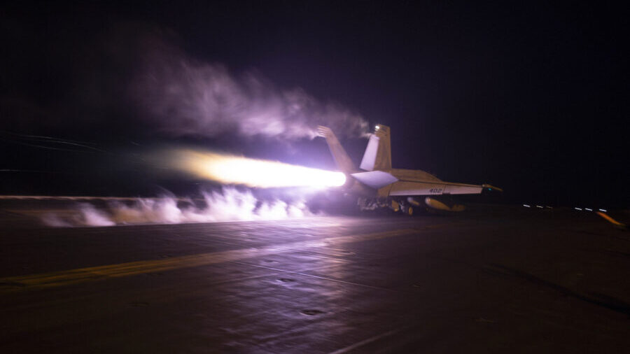 This image provided by the U.S. Navy shows an aircraft launching from USS Dwight D. Eisenhower (CVN...