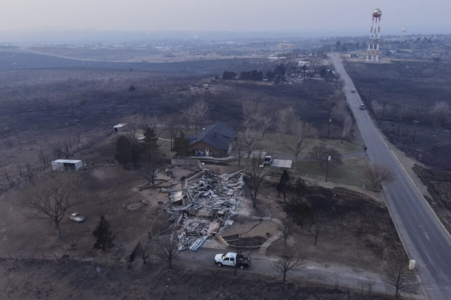 Damage to a property burned by the Smokehouse Creek Fire is seen Wednesday, Feb. 28, 2024, in Canad...