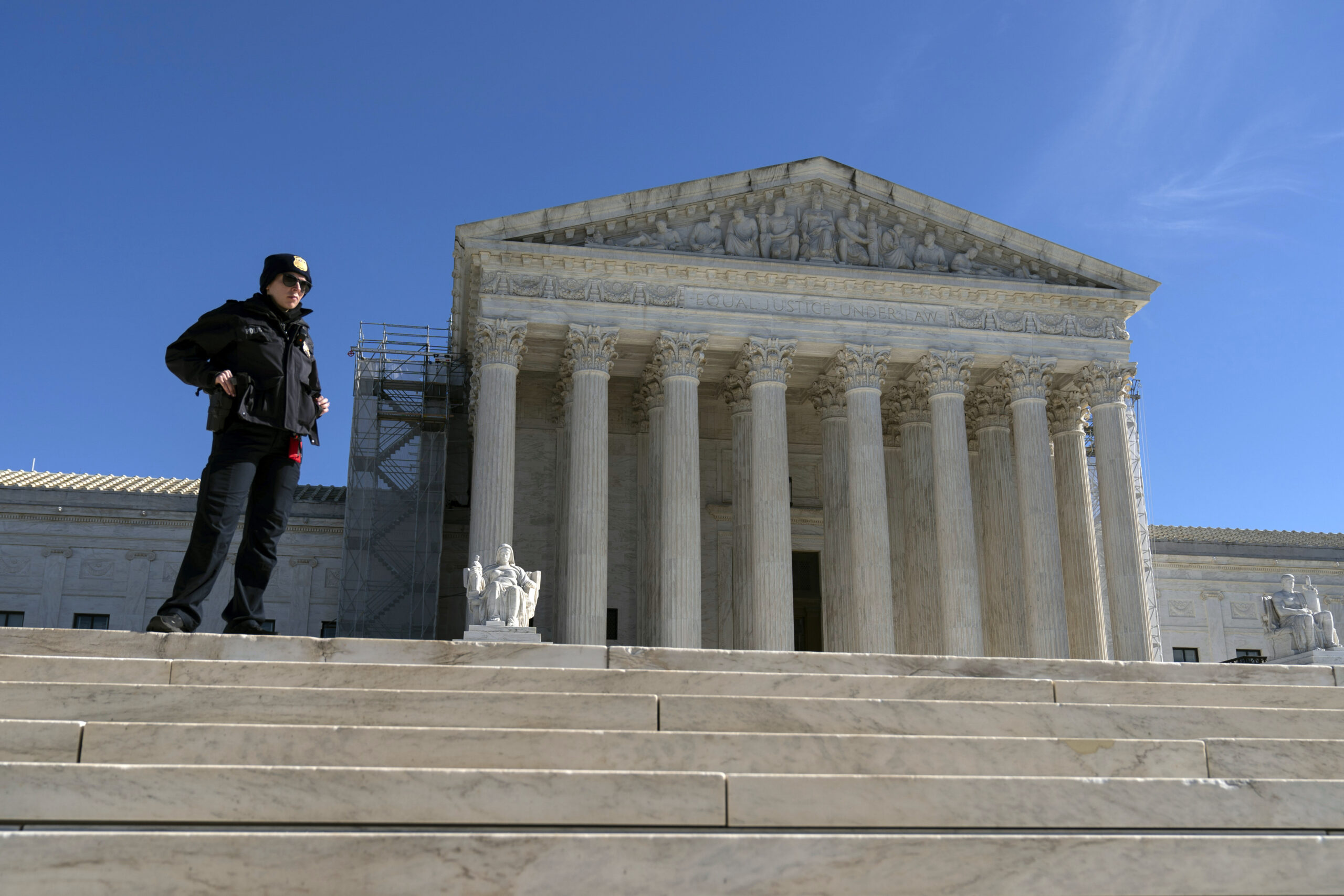 A U.S. Supreme Court police officer stands in front of the U.S. Supreme Court Wednesday, Feb. 7, 20...