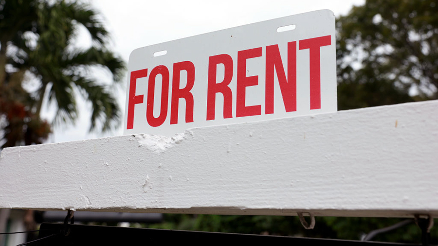 a sign announcing rent...